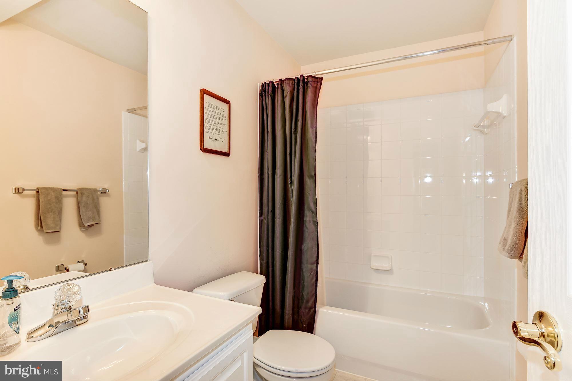 15530 Thompson Road Silver Spring, MD 20905 - Photo 26 of 30 a bathroom with a sink toilet and shower