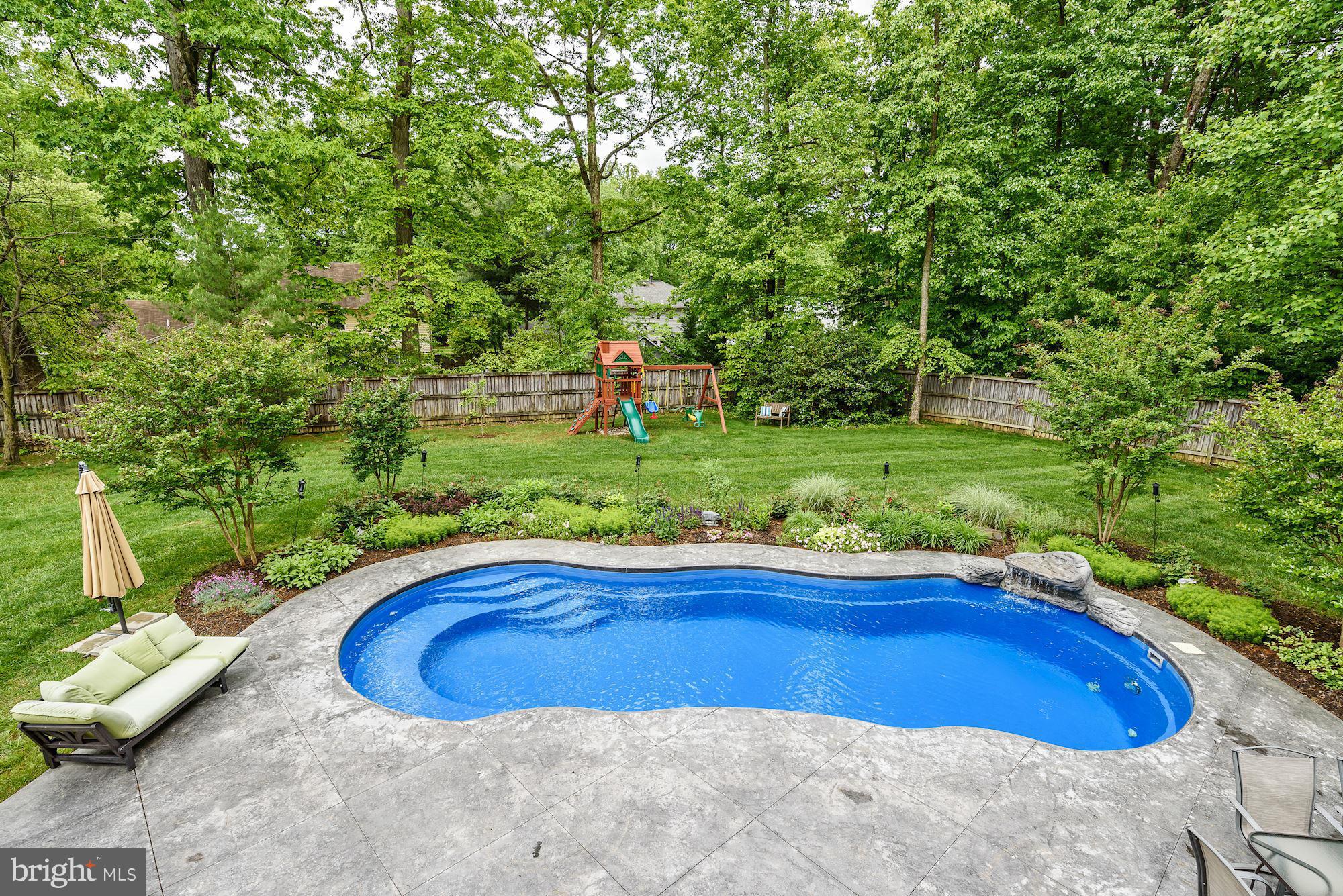 15530 Thompson Road Silver Spring, MD 20905 - Photo 29 of 30 a view of a swimming pool with a yard