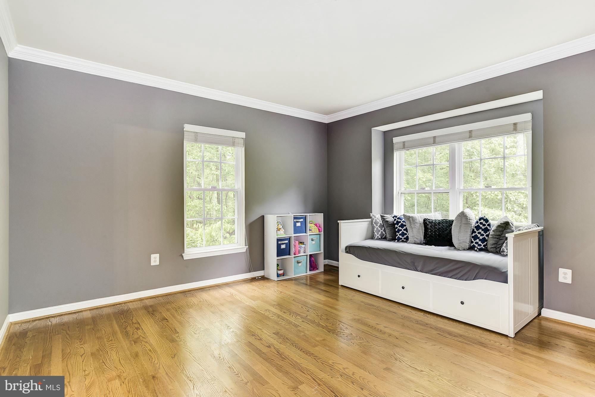 15530 Thompson Road Silver Spring, MD 20905 - Photo 4 of 30 a living room with a bed and a large window