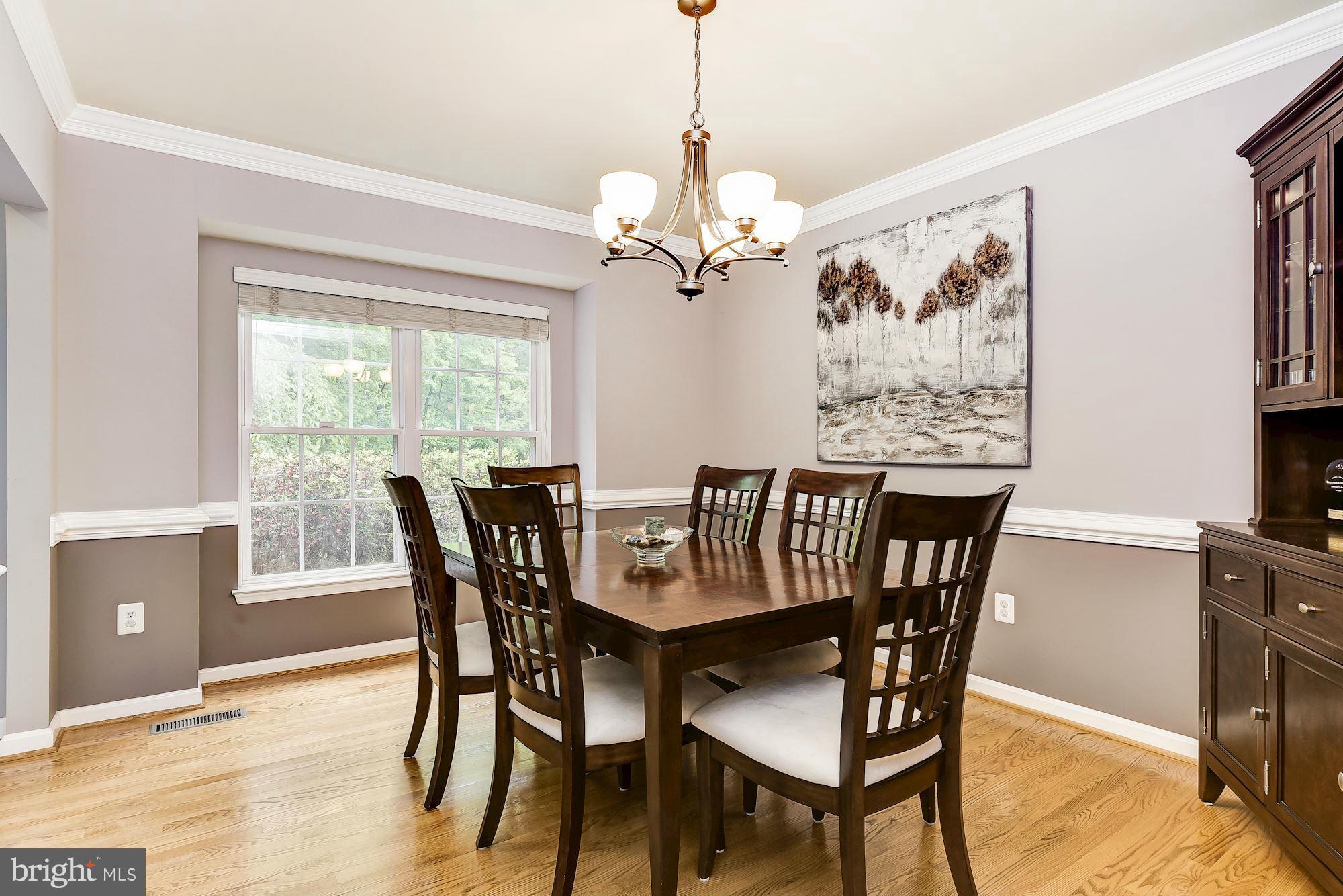 15530 Thompson Road Silver Spring, MD 20905 - Photo 6 of 30 a view of a dining room with furniture window and wooden floor