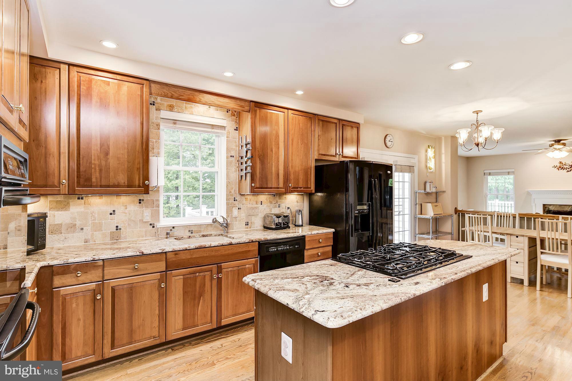 15530 Thompson Road Silver Spring, MD 20905 - Photo 10 of 30 a kitchen with a sink stove and refrigerator