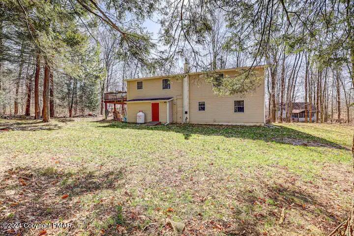 Sir Lionel Court Blakeslee, PA 18610 - Photo 20 of 23 a view of a white house with a big yard and large trees