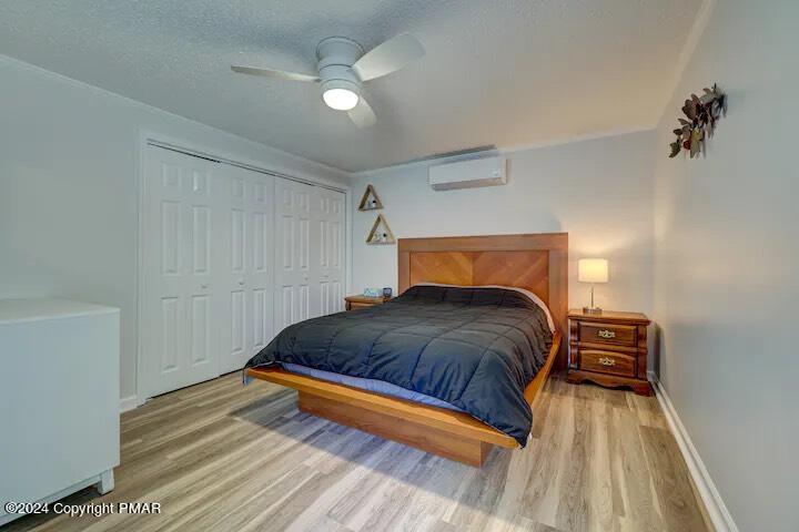 Sir Lionel Court Blakeslee, PA 18610 - Photo 8 of 23 a bedroom with a bed and a chandelier