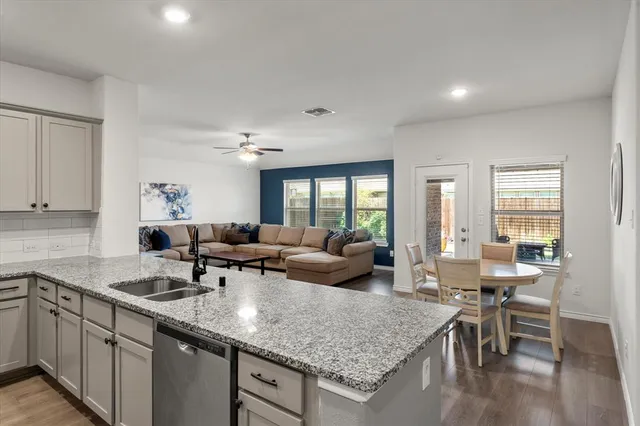 a view of a kitchen counter top space and living room