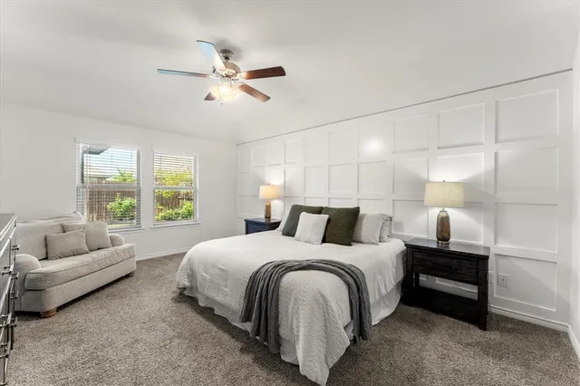 a bedroom with a bed and a couch