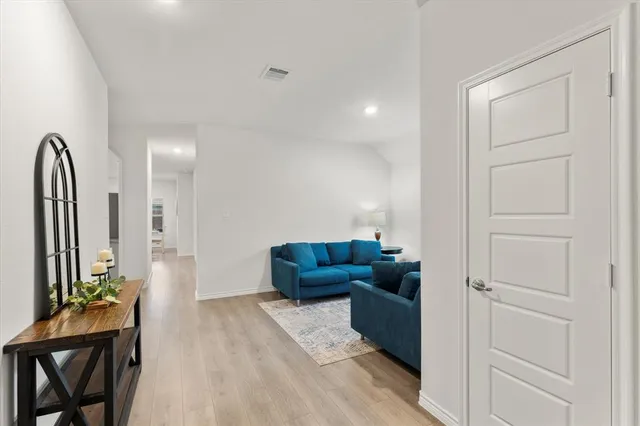 a living room with furniture and a gate