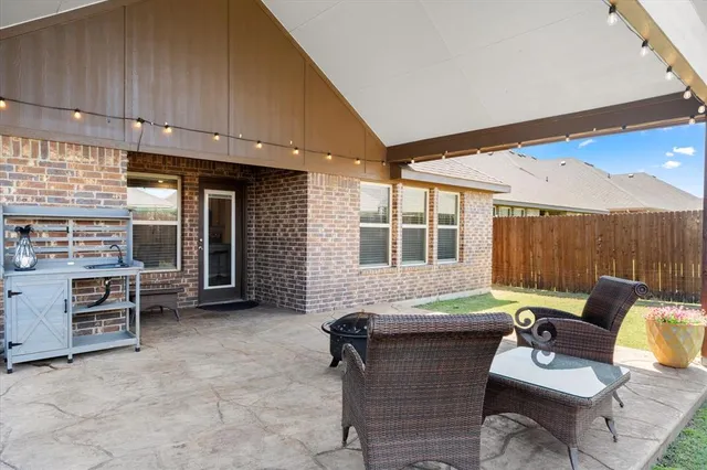 a living room with furniture and large window