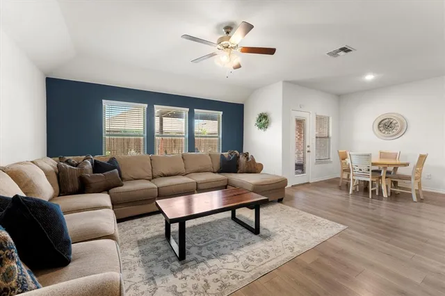 a living room with furniture and a large window