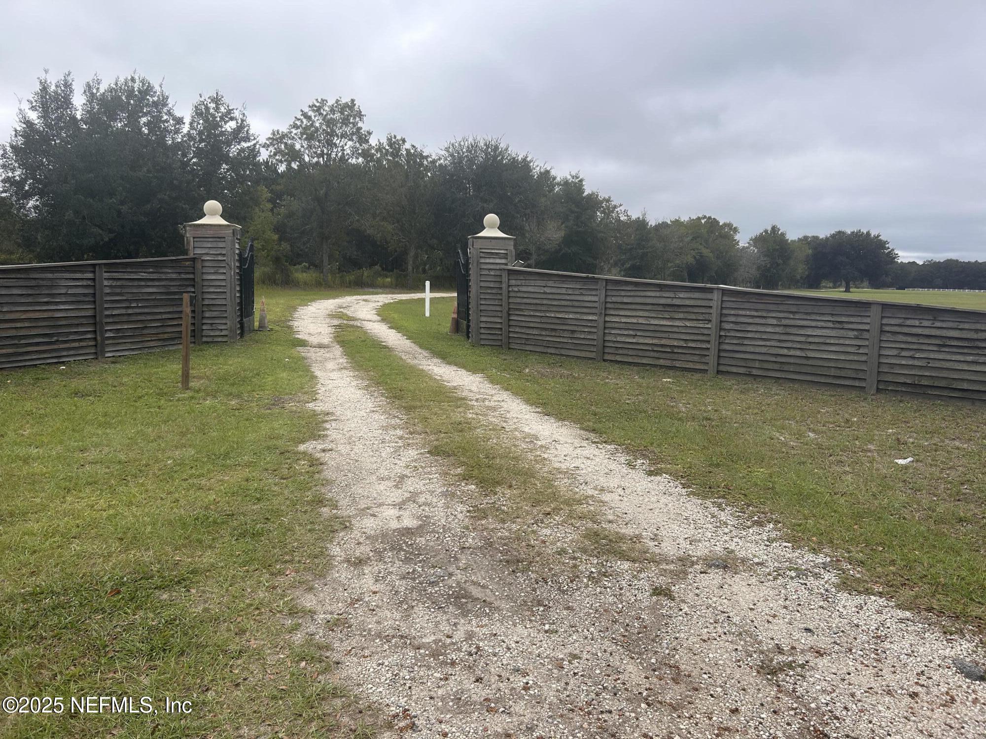 5411 State Road 21 Keystone Heights, FL 32656 - Photo 18 of 31 a view of a field with wooden fence