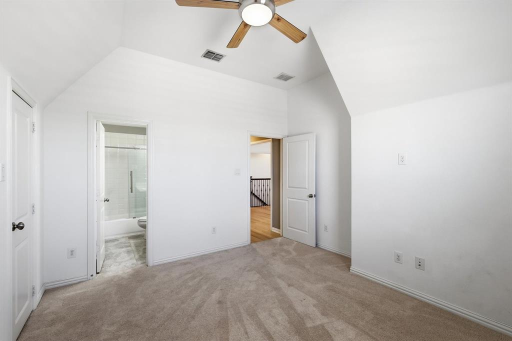1933 Snapdragon Road Frisco, TX 75033 - Photo 31 of 40 Carpeted room featuring a vaulted ceiling and a wood-finish ceiling fan