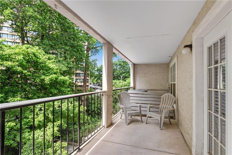 3655 Habersham Road Northeast, Unit 244B Atlanta, GA 30305 - Photo 22 of 34 a view of a two chairs in the balcony