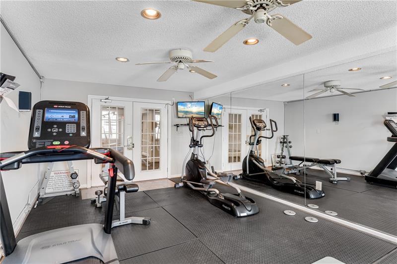 3655 Habersham Road Northeast, Unit 244B Atlanta, GA 30305 - Photo 32 of 34 a view of a room with gym equipment