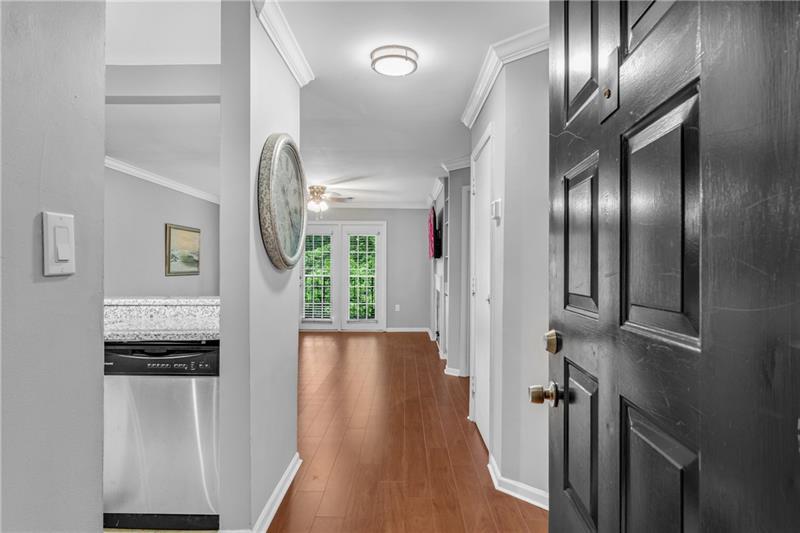 3655 Habersham Road Northeast, Unit 244B Atlanta, GA 30305 - Photo 8 of 34 a view of a hallway with wooden floor