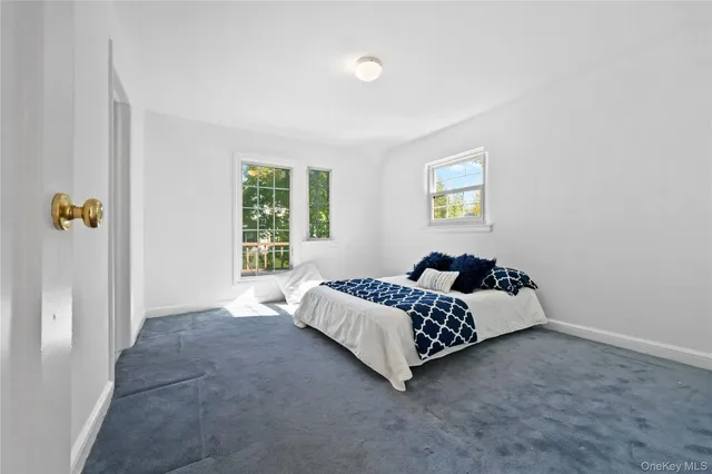 a bed room with a bed and a window