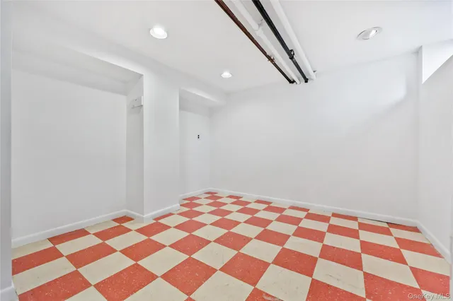 a bedroom with a black and white checkered floor