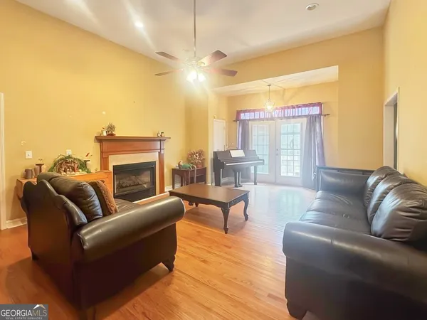a living room with furniture fireplace and a flat screen tv
