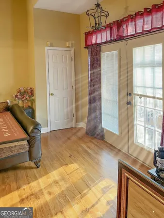 a view of a livingroom with furniture and a window