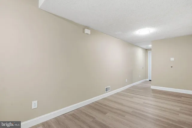 a kitchen with a refrigerator and a sink