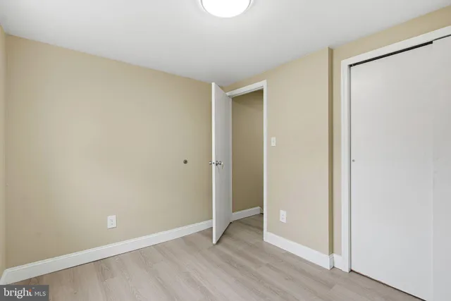 a bathroom with a granite countertop sink mirror vanity and toilet