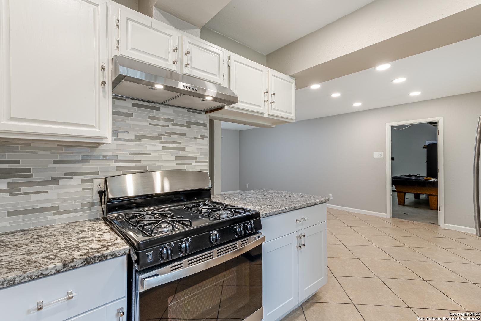 555 Patricia San Antonio, TX 78216 - Photo 13 of 33 a stove top oven sitting inside of a kitchen
