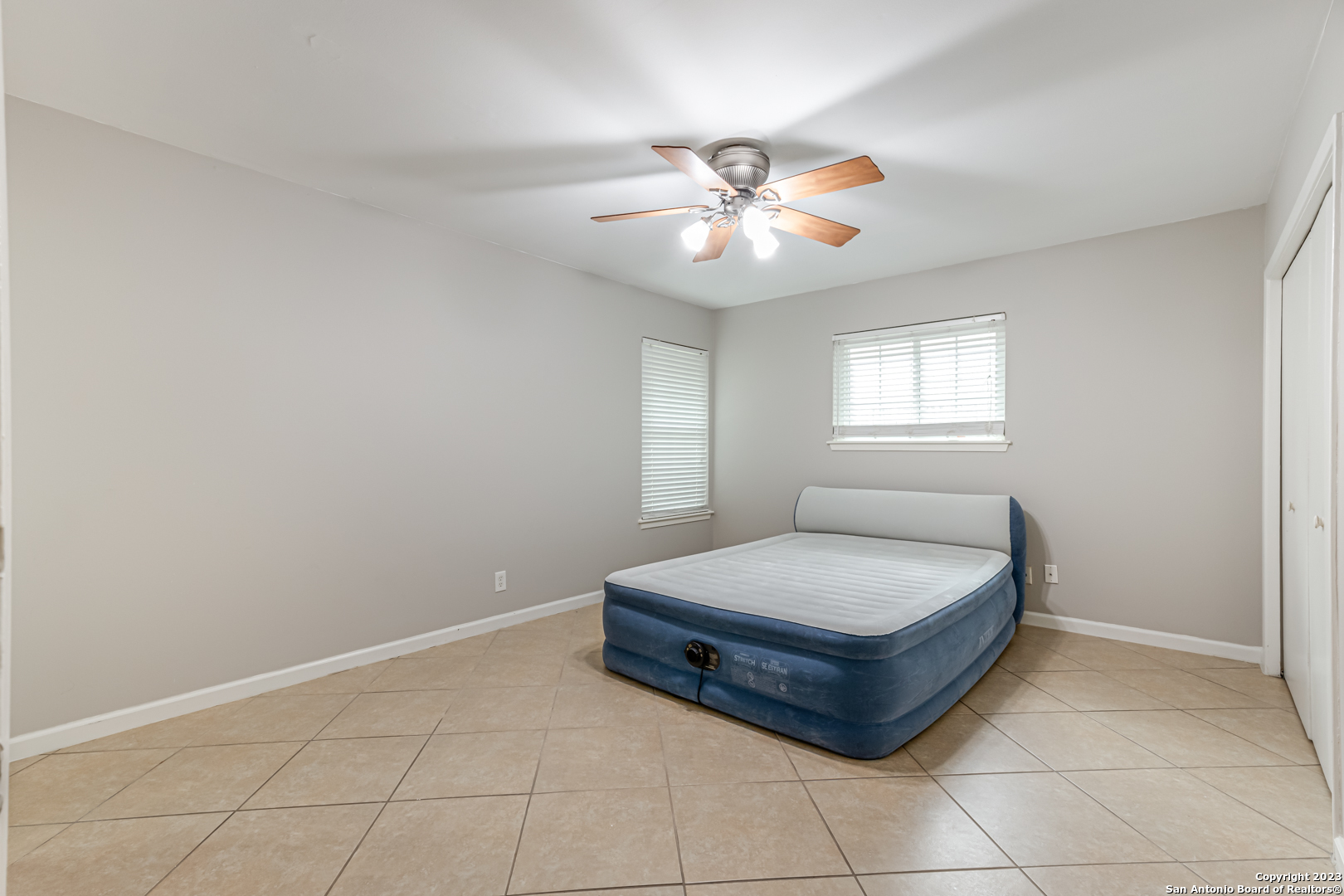 555 Patricia San Antonio, TX 78216 - Photo 14 of 33 a living room with a bed and a window