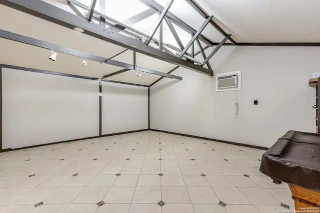 a view of a livingroom with wooden floor and white walls