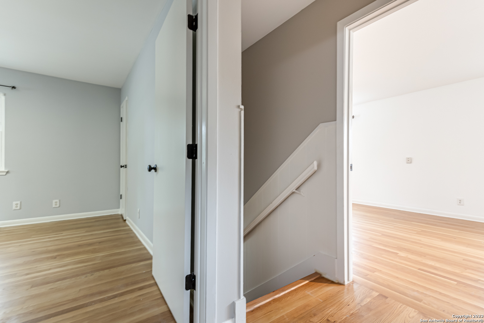 555 Patricia San Antonio, TX 78216 - Photo 21 of 33 a view of a hallway with wooden floor and staircase