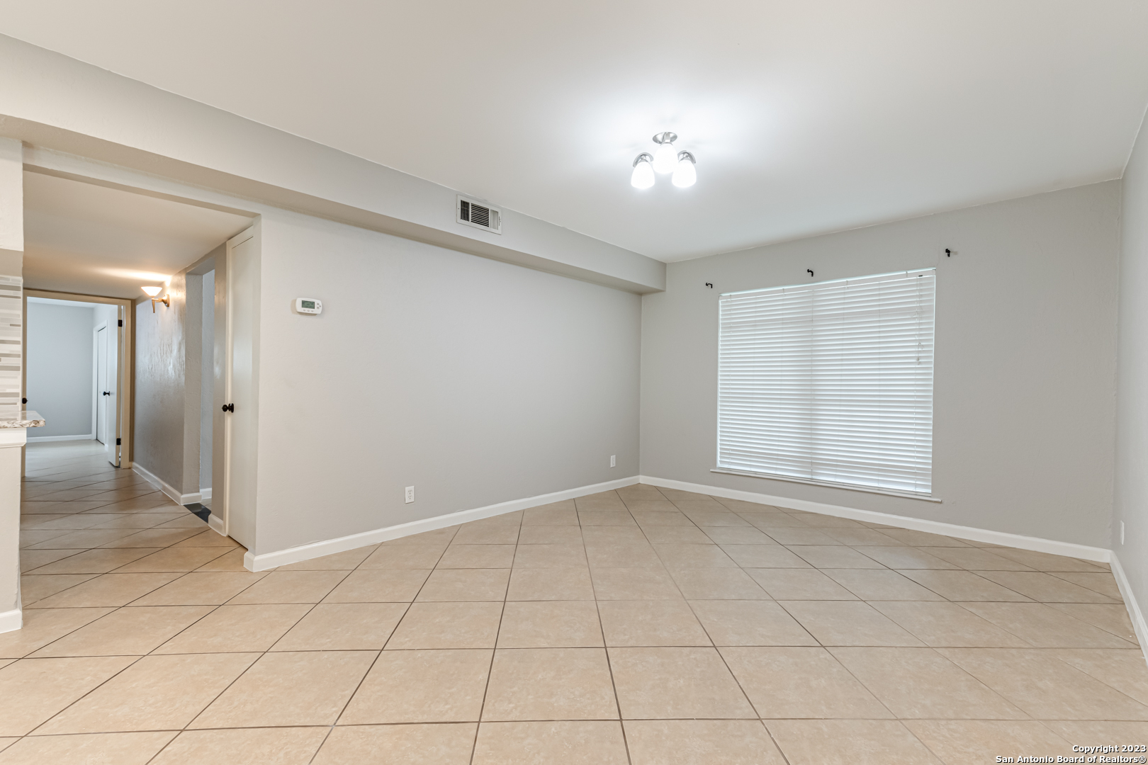 555 Patricia San Antonio, TX 78216 - Photo 7 of 33 a view of an empty room with a window