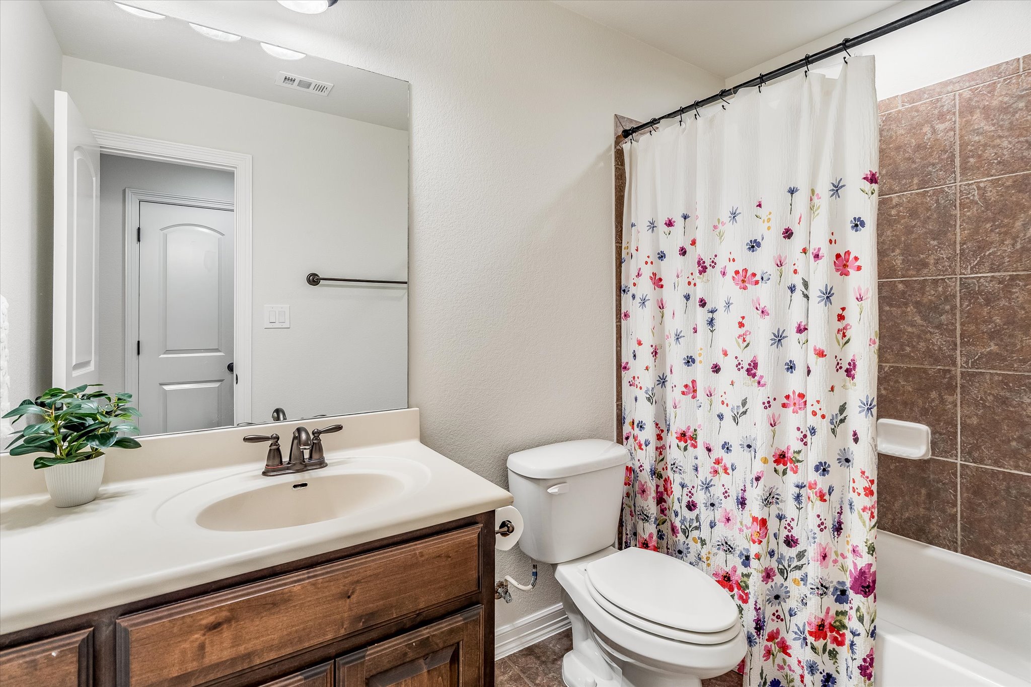 226 Galloway Lane Austin, TX 78737 - Photo 24 of 30 Full bath featuring vanity and shower / bath combo with shower curtain