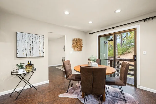 a kitchen with granite countertop cabinets stainless steel appliances a sink and a window