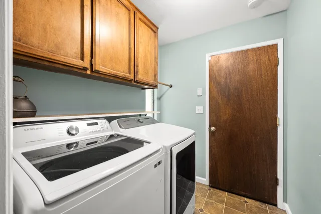 a bathroom with a shower and a sink
