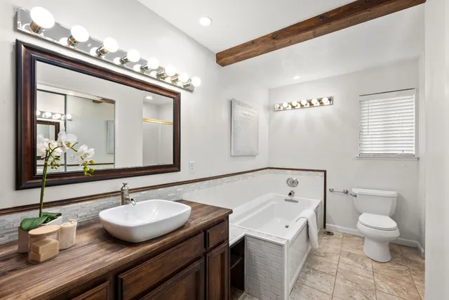 a view of a livingroom with a fireplace and window