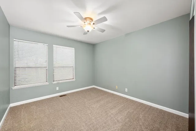 a view of a workspace with furniture