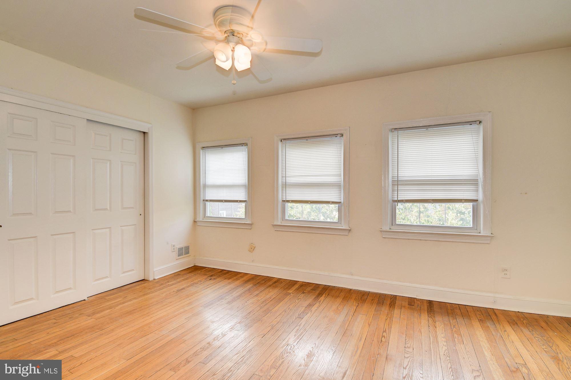 1218 Portner Road Alexandria, VA 22314 - Photo 10 of 31 a view of an empty room with wooden floor and a window