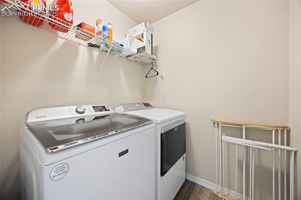 4536 Gneiss Loop Colorado Springs, CO 80938 - Photo 13 of 24 a utility room with dryer and washer