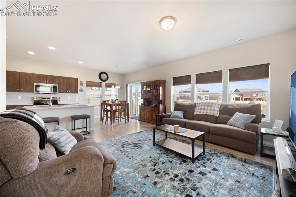4536 Gneiss Loop Colorado Springs, CO 80938 - Photo 17 of 24 a living room with furniture and a large window