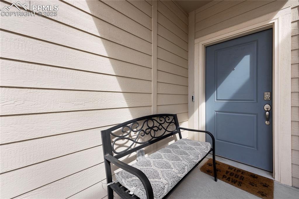 4536 Gneiss Loop Colorado Springs, CO 80938 - Photo 2 of 24 a view of wooden bench in front of gate
