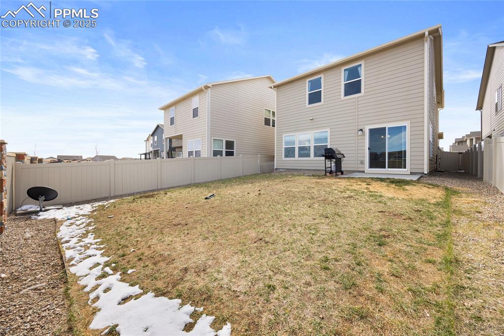 4536 Gneiss Loop Colorado Springs, CO 80938 - Photo 23 of 24 a view of a house with backyard and sitting area