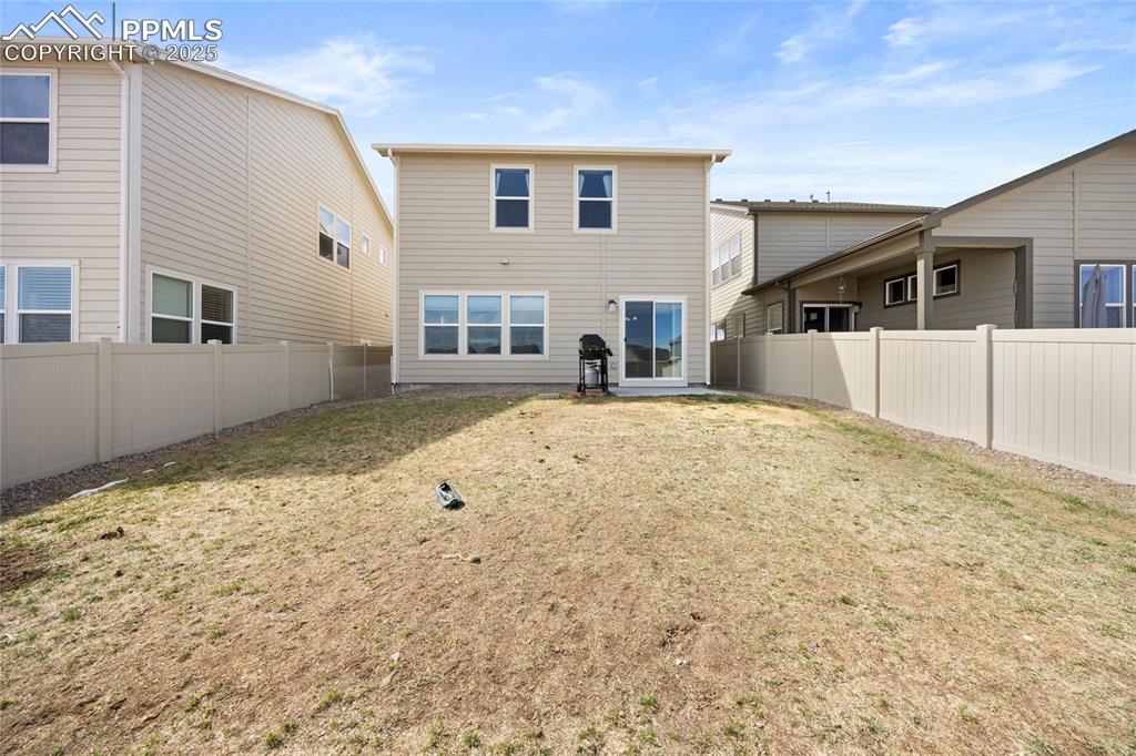 4536 Gneiss Loop Colorado Springs, CO 80938 - Photo 24 of 24 a view of a house with a yard