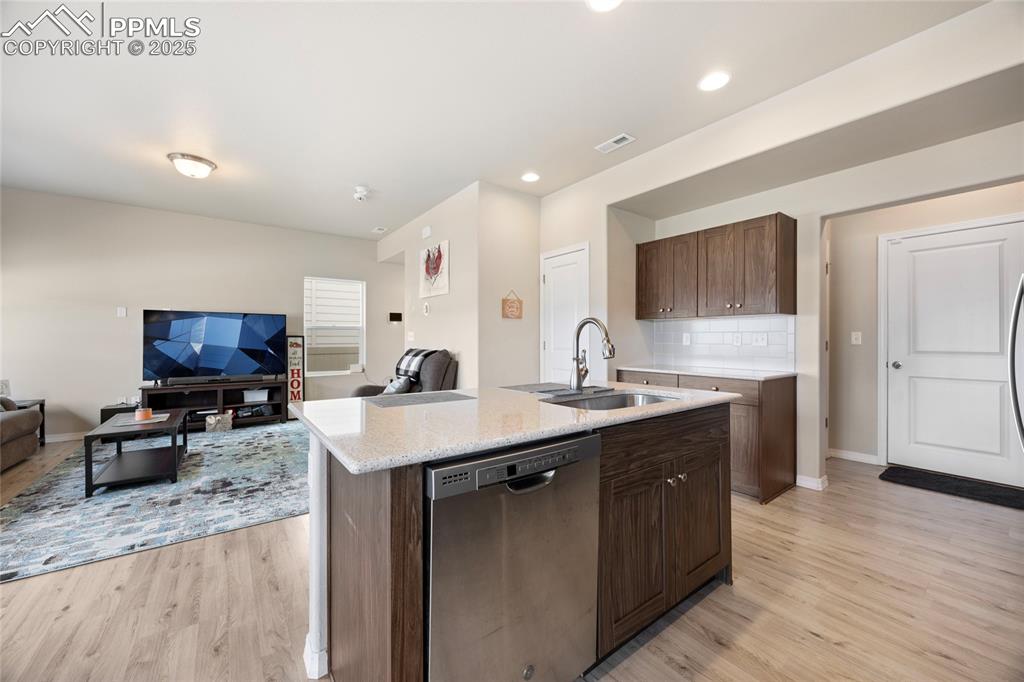 4536 Gneiss Loop Colorado Springs, CO 80938 - Photo 4 of 24 a kitchen with sink stove and refrigerator