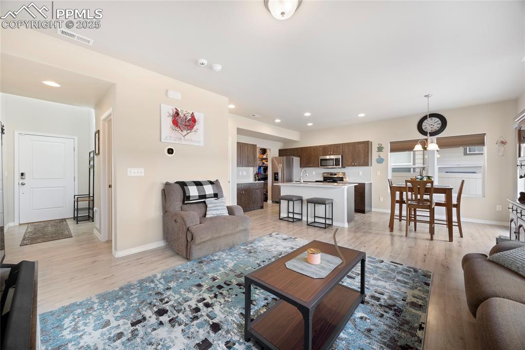 4536 Gneiss Loop Colorado Springs, CO 80938 - Photo 9 of 24 a living room with furniture and a table
