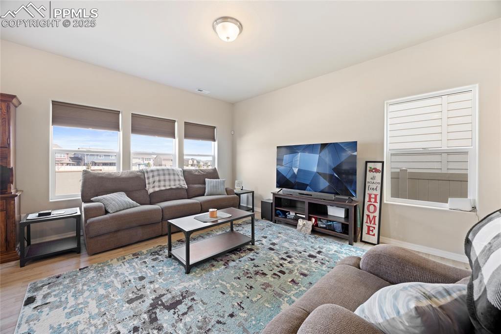 4536 Gneiss Loop Colorado Springs, CO 80938 - Photo 10 of 24 a living room with furniture and a large window
