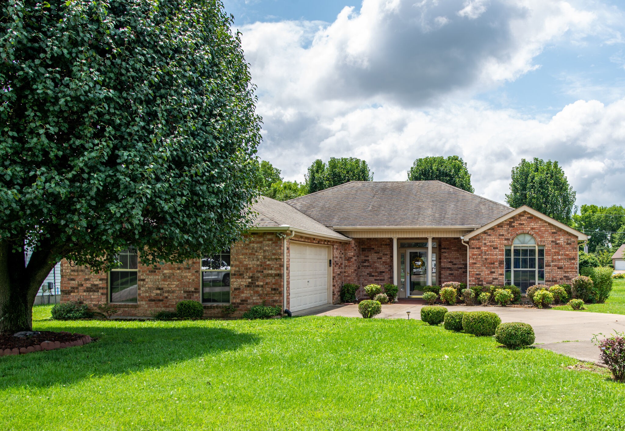 2123 Spring Hill Circle Spring Hill, TN 37174 - Photo 1 of 32 a front view of a house with yard and green space