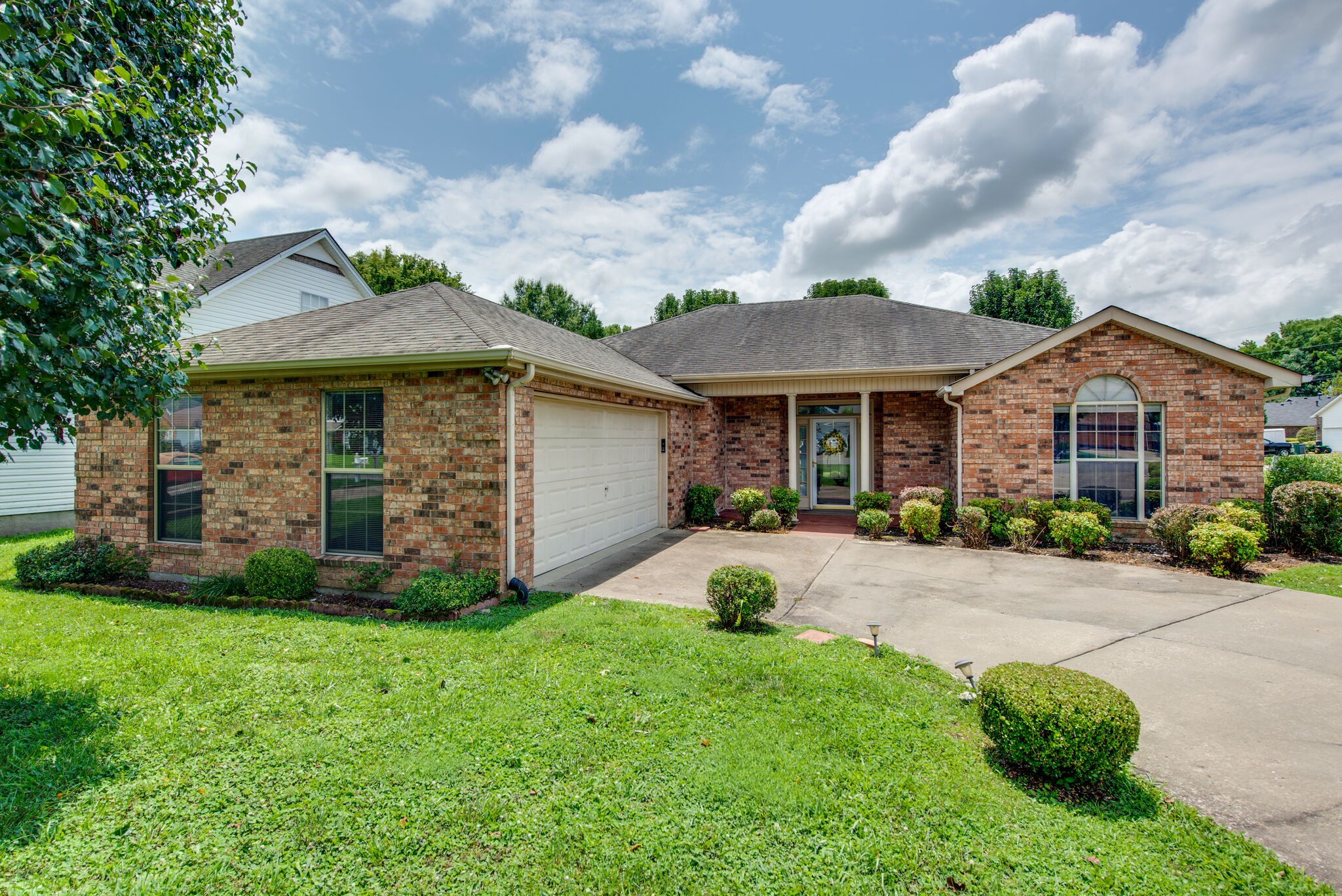 2123 Spring Hill Circle Spring Hill, TN 37174 - Photo 2 of 32 a front view of a house with garden