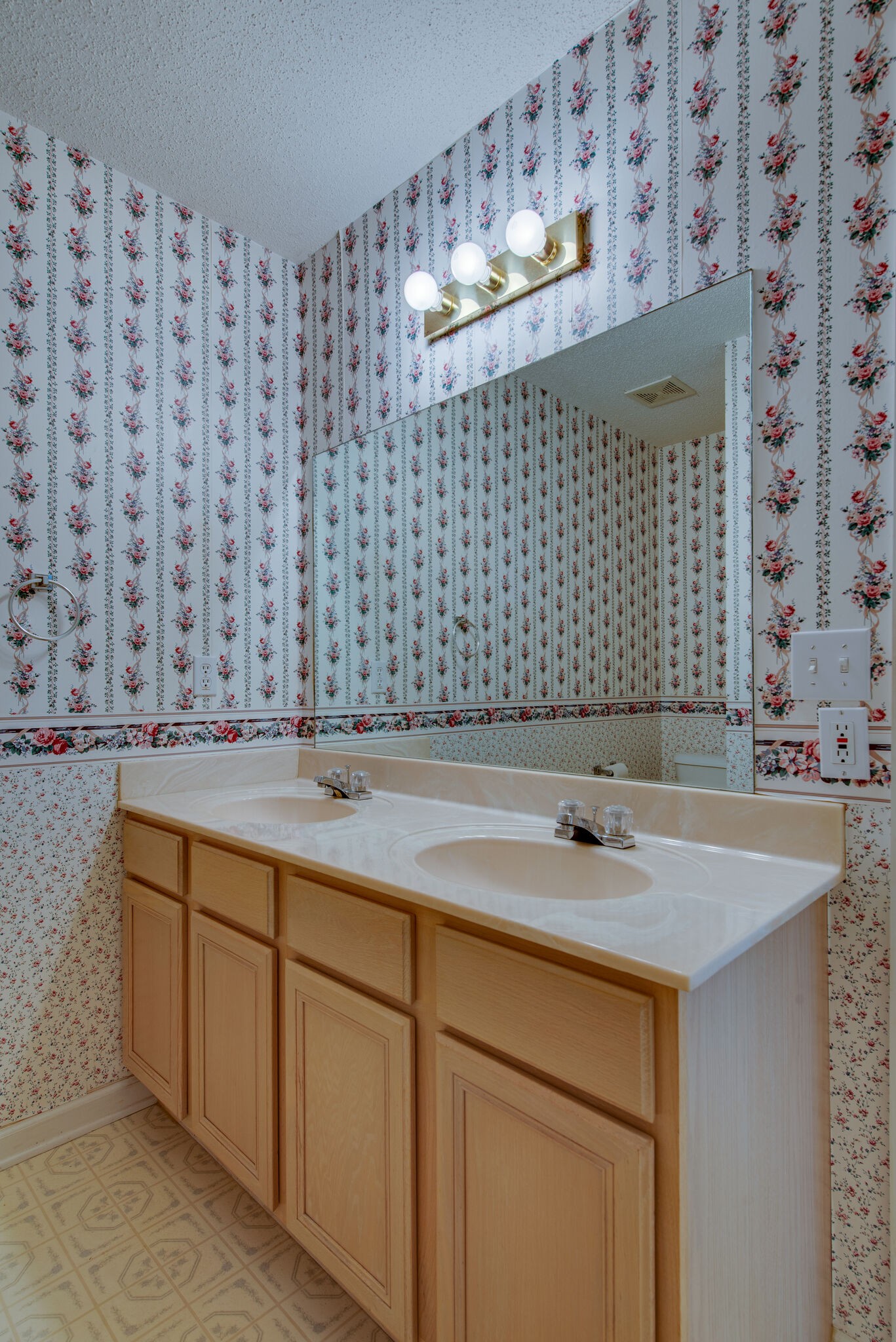 2123 Spring Hill Circle Spring Hill, TN 37174 - Photo 17 of 32 a bathroom with a sink and a mirror