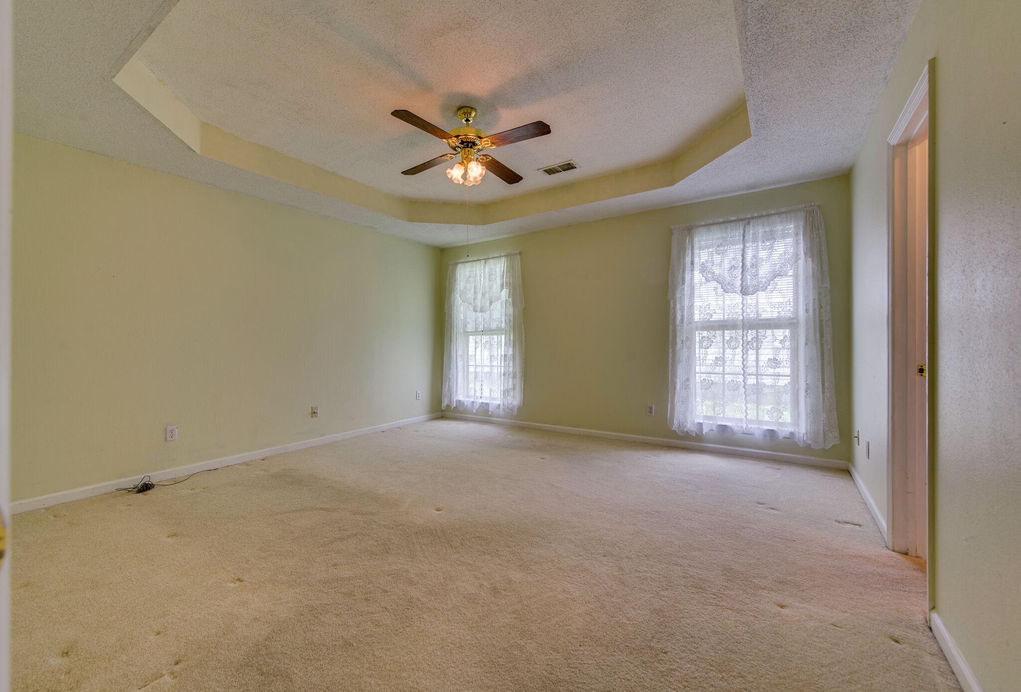2123 Spring Hill Circle Spring Hill, TN 37174 - Photo 20 of 32 a view of an empty room with chandelier fan and a window