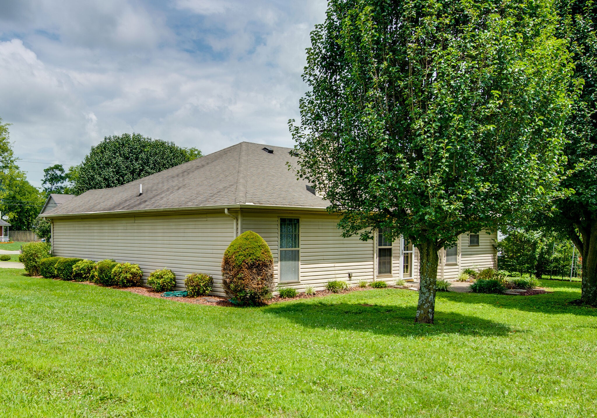 2123 Spring Hill Circle Spring Hill, TN 37174 - Photo 32 of 32 a backyard of a house with lots of green space