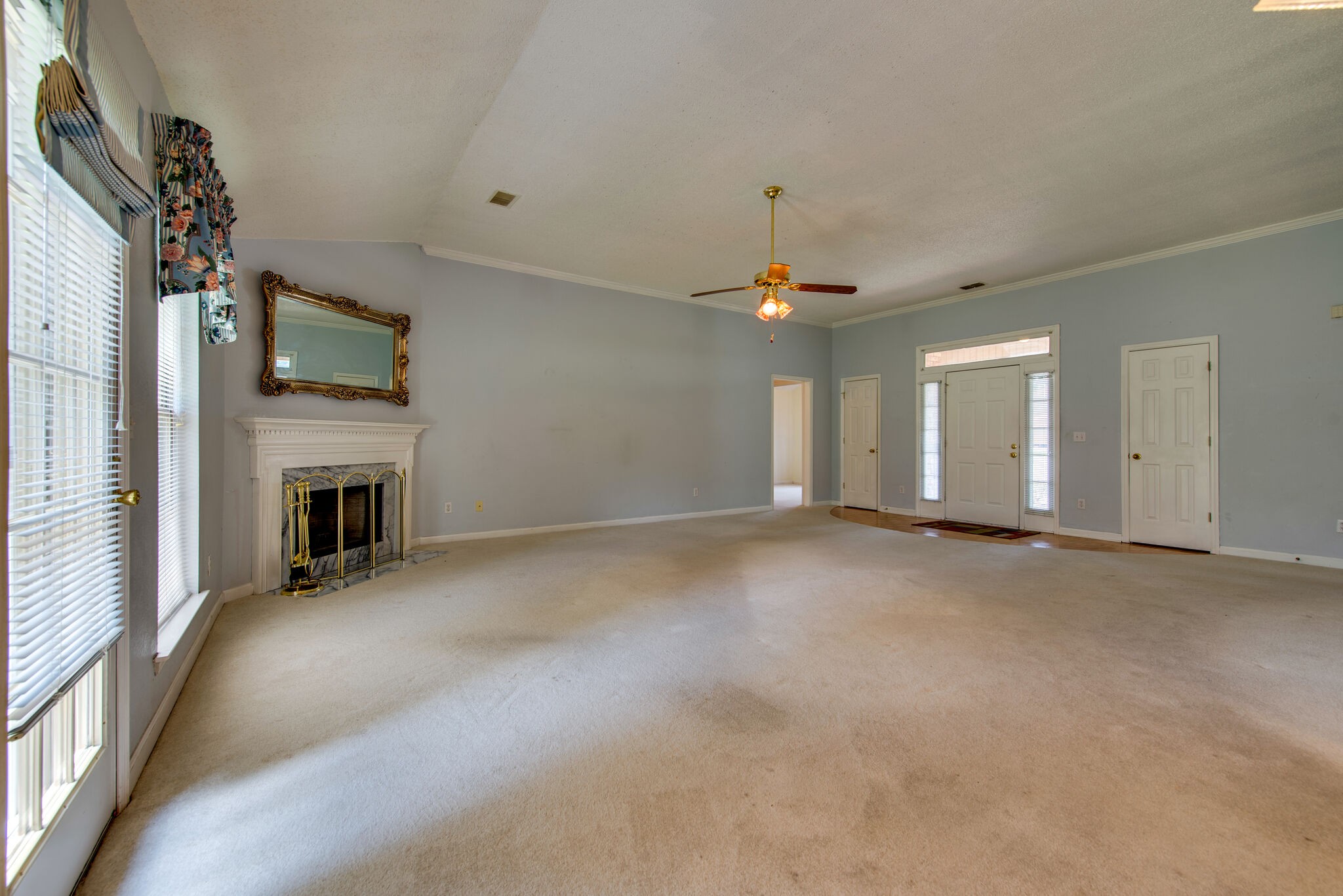 2123 Spring Hill Circle Spring Hill, TN 37174 - Photo 7 of 32 a view of a livingroom with an empty space and a fireplace