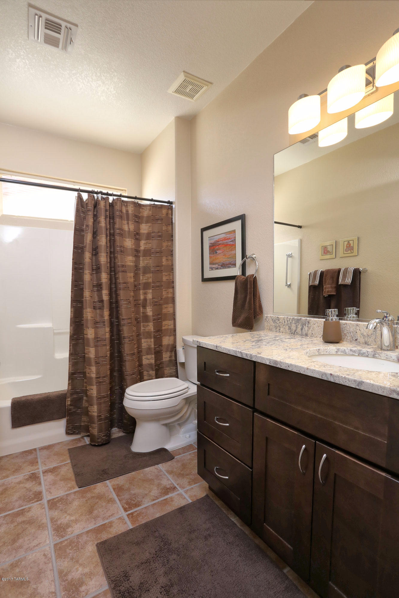 1065 East Royal Oak Road Oro Valley, AZ 85755 - Photo 15 of 19 a bathroom with a toilet a sink and mirror