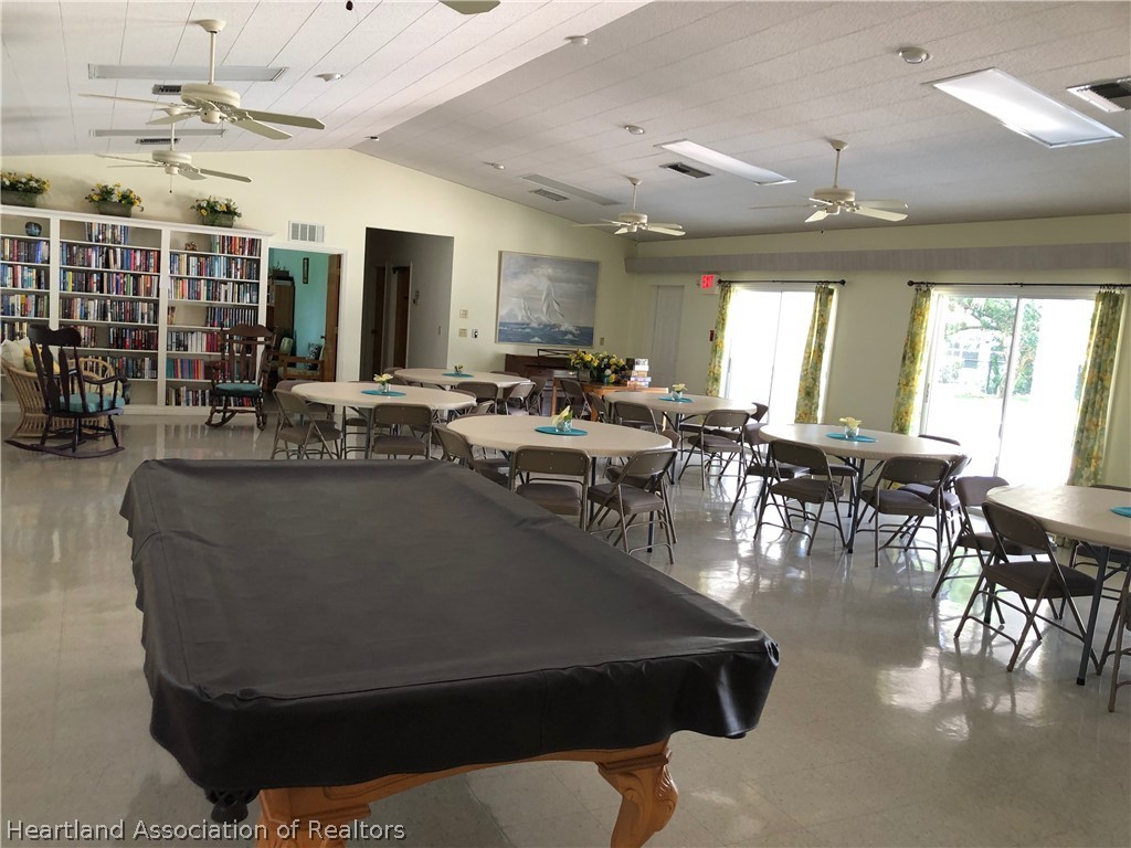 2510 Davis Circle Sebring, FL 33870 - Photo 18 of 23 a living room with lots of furniture a chandelier and a dining table